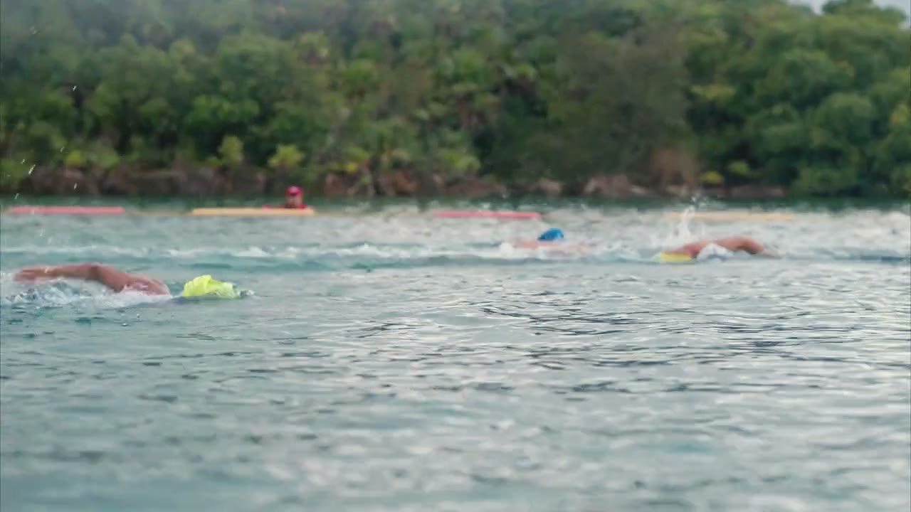 Race morning: runners and riders on a coastal road